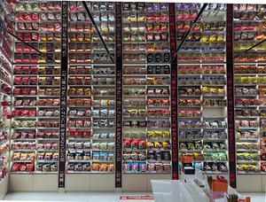 a large display wall filled with instant noodles at k-food lab